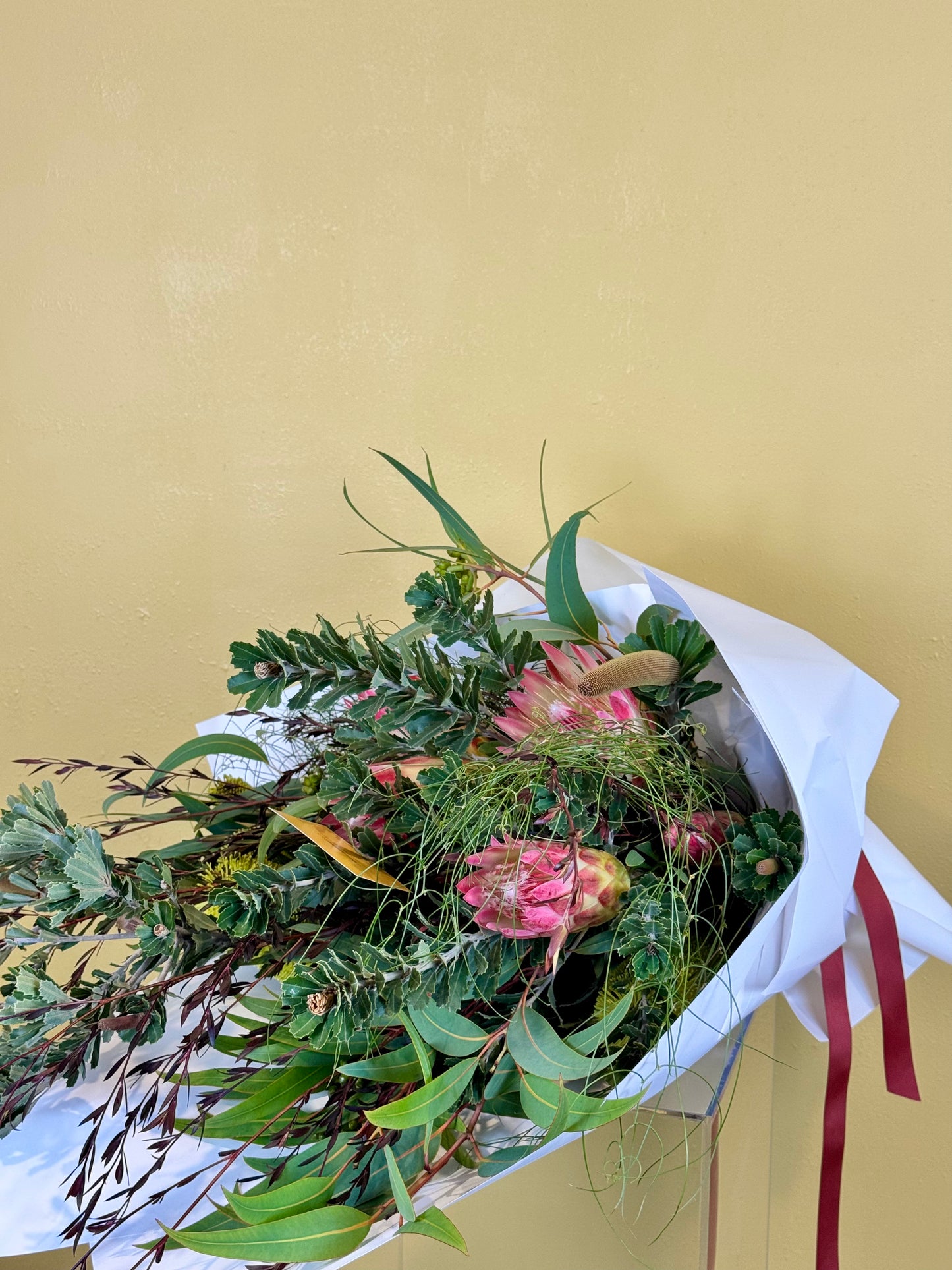 Bouquet of Australian Native Flowers  such as Banksia, Protea and Wattle wrapped in White paper